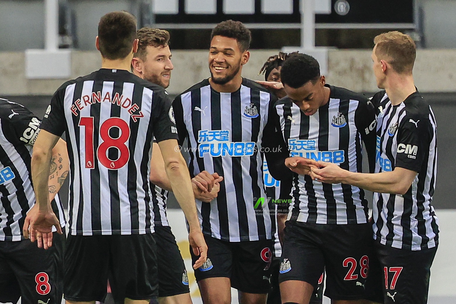 Joelinton #9 of Newcastle United celebrates his goal with his teammates to make it 2-2