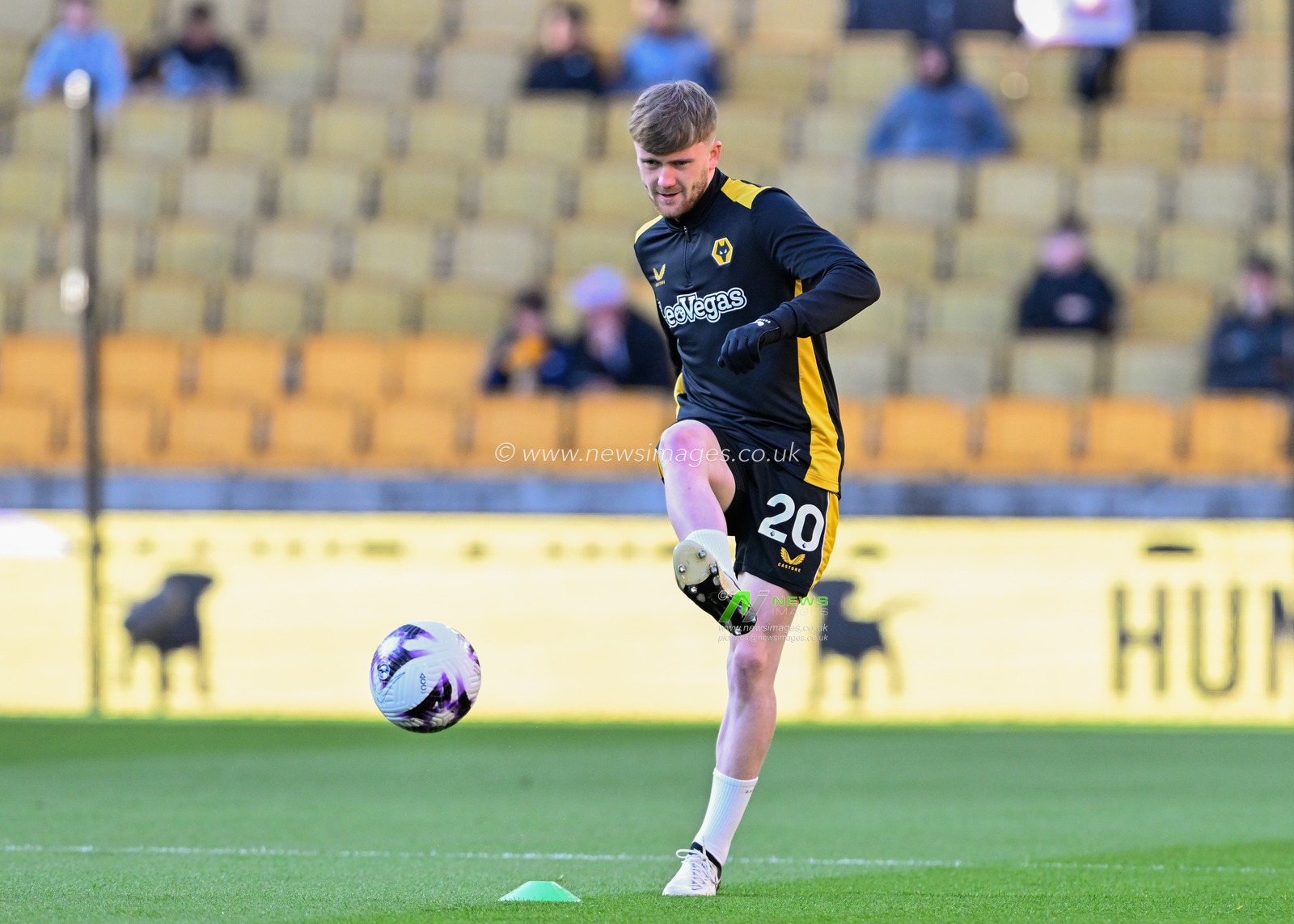 Tommy Doyle of Wolverhampton Wanderers warms up ahead of the match, during the Premier League match Wolverhampton Wanderers vs Arsenal at Molineux, Wolverhampton, United Kingdom, 20th April 2024

(Photo by Cody Froggatt/News Images)