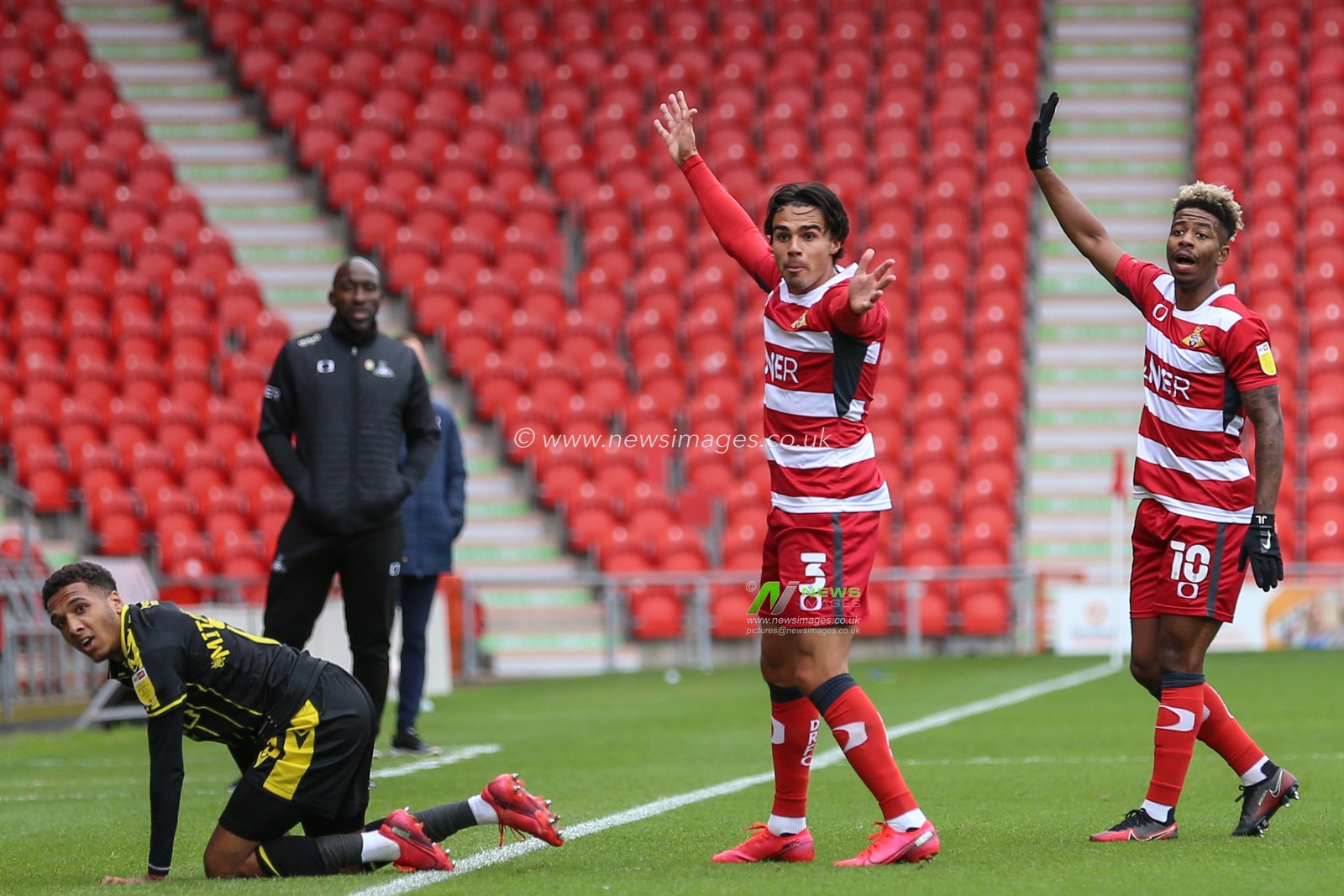 Reece James (3) of Doncaster Rovers and Jason Lokilo (10) of Doncaster Rovers appeal for a throw in