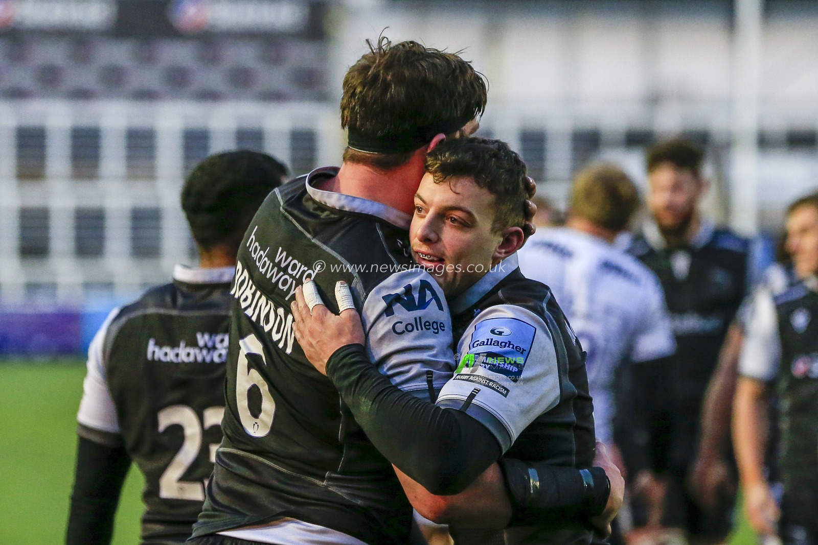 Adam Radwan of Newcastle Falcons and Sean Robinson of Newcastle Falcons celebrate at full-time