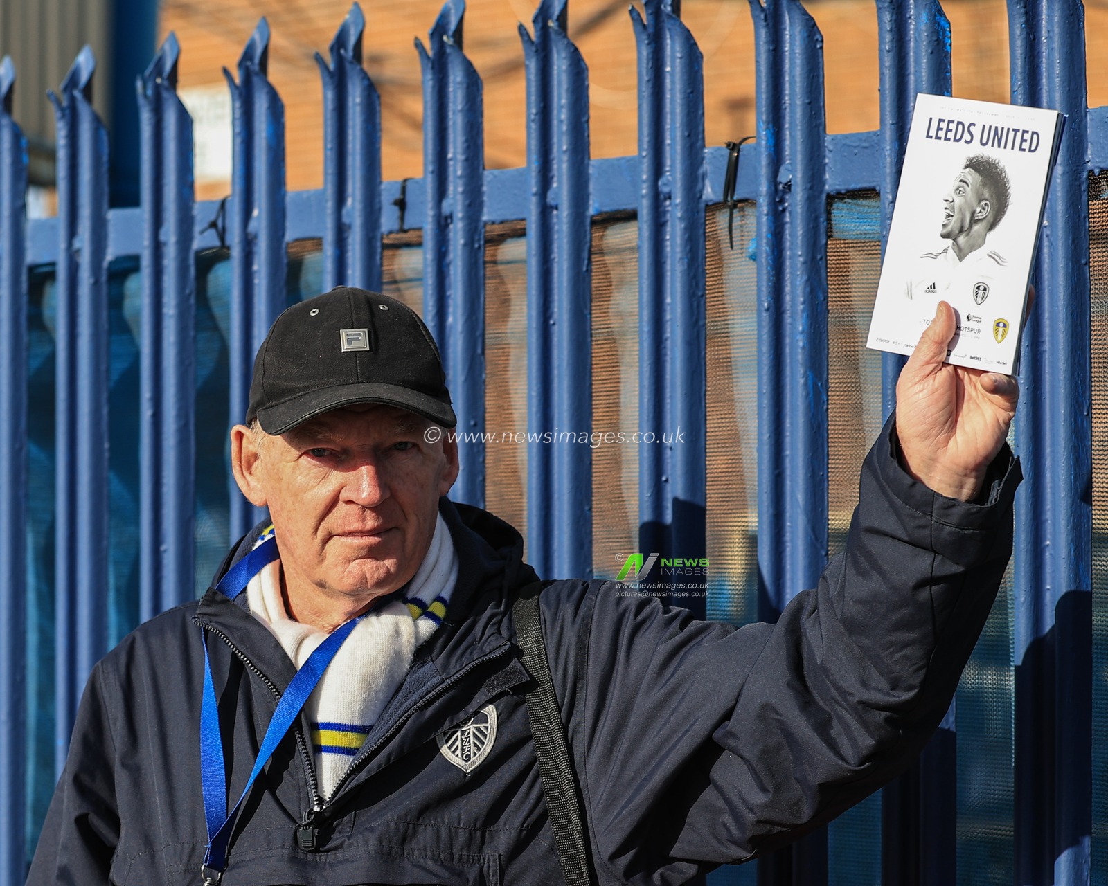 A man sells todays match day program with Rodrigo Moreno #19 of Leeds United on the from cover