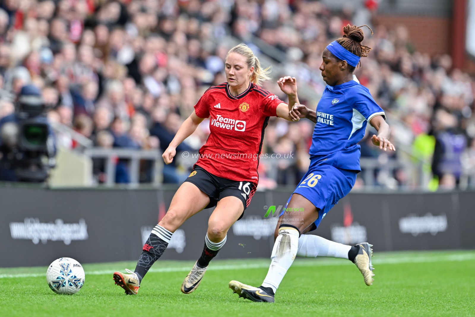 Lisa Naalsund of Manchester United Women and Kadeisha Buchanan of Chelsea Women chase down the ball, during the Adobe Women's FA Cup Semi-Final match Manchester United Women vs Chelsea FC Women at Leigh Sports Village, Leigh, United Kingdom, 14th April 2024

(Photo by Cody Froggatt/News Images)