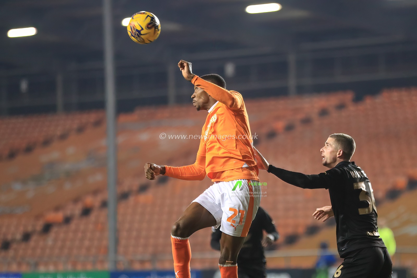 Marvin Ekpiteta #21 of Blackpool heads clear during the Bristol Street Motors Trophy match Blackpool vs Barnsley at Bloomfield Road, Blackpool, United Kingdom, 5th December 2023

(Photo by Alfie Cosgrove/News Images)