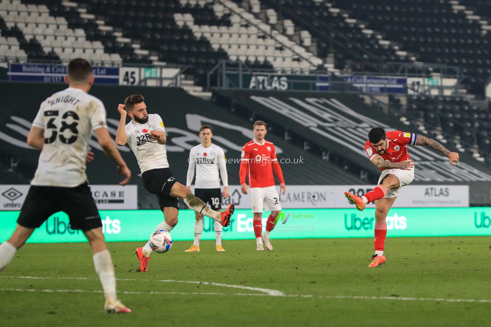 Alex Mowatt #27 of Barnsley shoots on goal