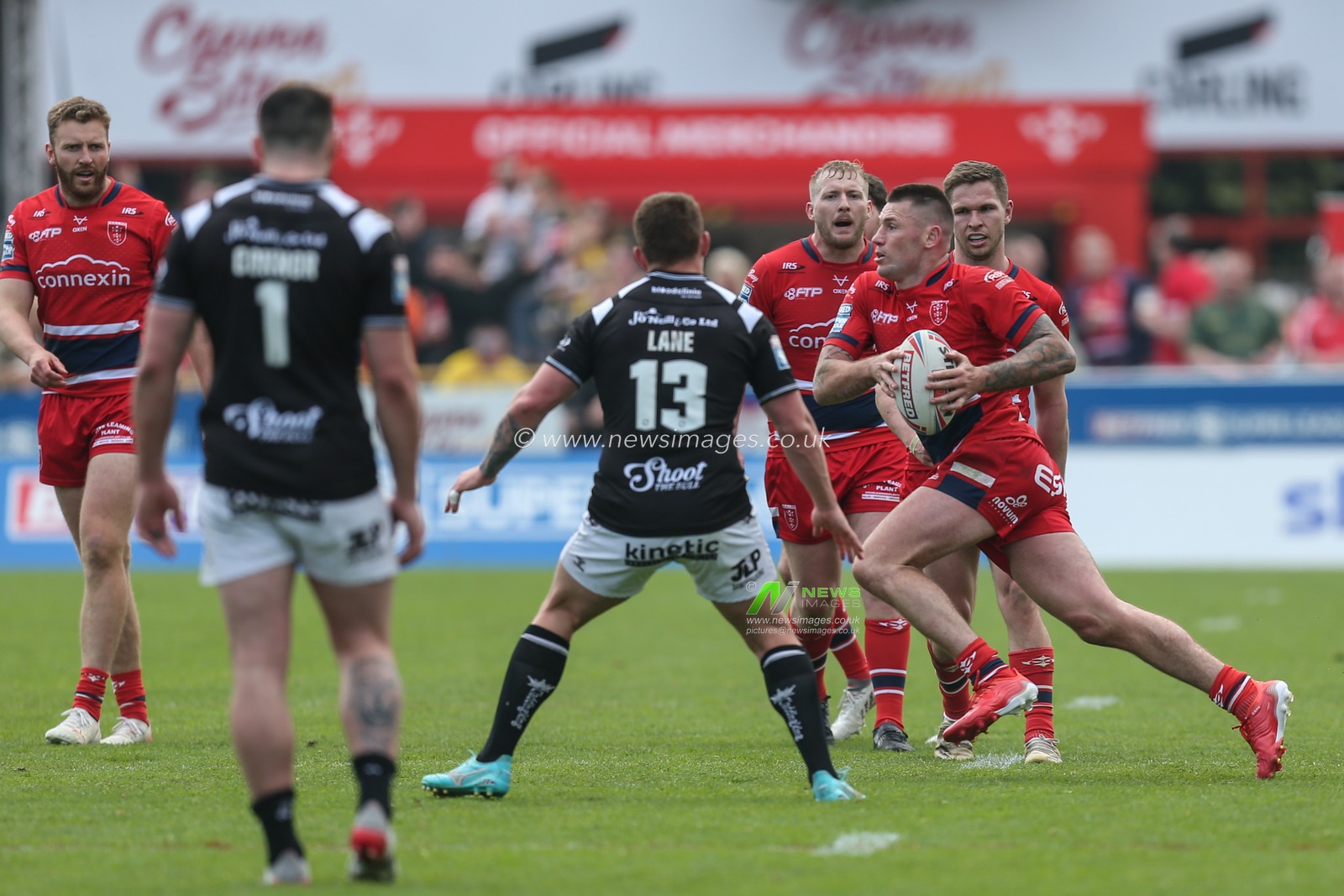 Shaun Kenny-Dowall #4 of Hull KR runs across the Hull FC defensive line