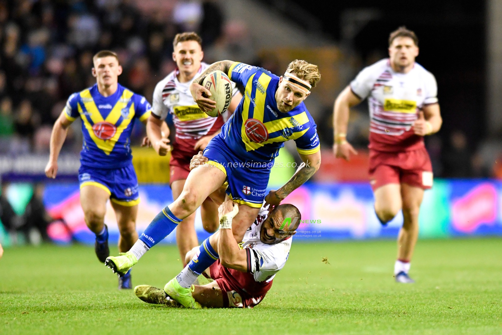 30th January 2020, DW Stadium, Wigan, England; Betfred Super League, Wigan Warriors v Warrington Wolves : Thomas Leuluai (7) of Wigan Warriors tackles Blake Austin (6) of Warrington Wolves