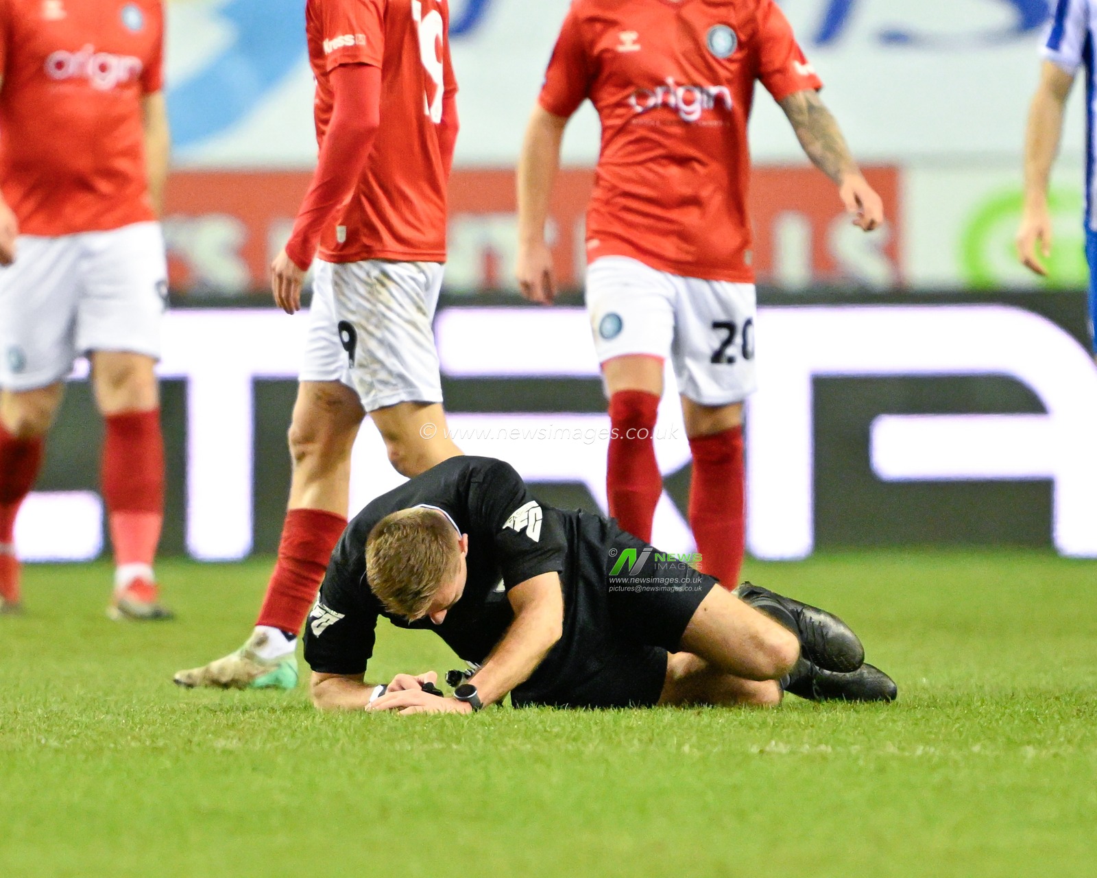 Referee Adam Herczeg goes down with an injury, during the Sky Bet League 1 match Wigan Athletic vs Wycombe Wanderers at DW Stadium, Wigan, United Kingdom, 23rd January 2024

(Photo by Cody Froggatt/News Images)