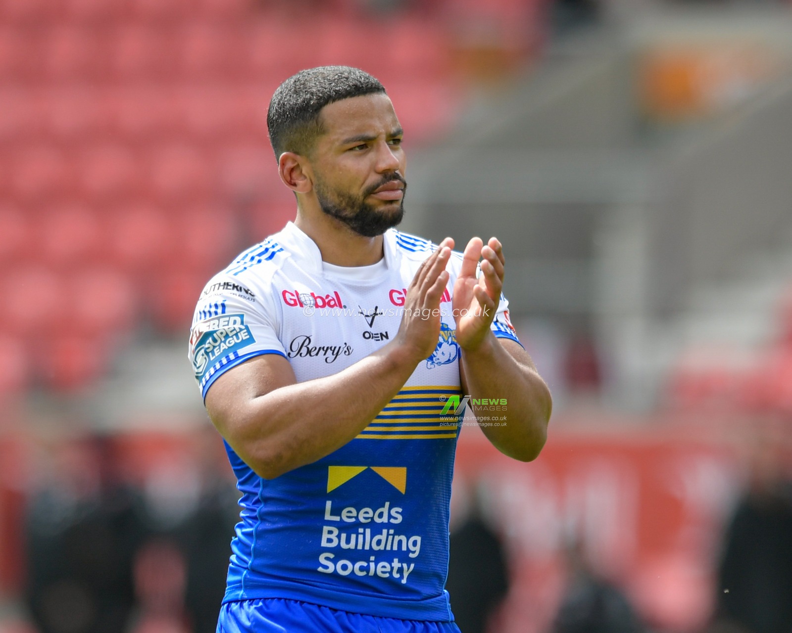 Kruise Leeming (9) of Leeds Rhinos applauds the travelling supporters at the end of the game