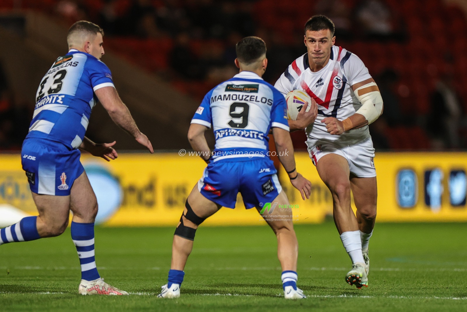 Lambert Belmas of France looks for a way past Peter Mamouzelos of Greece during the Rugby League World Cup 2021 match France vs Greece at Eco-Power Stadium, Doncaster, United Kingdom, 17th October 2022

(Photo by Mark Cosgrove/News Images)