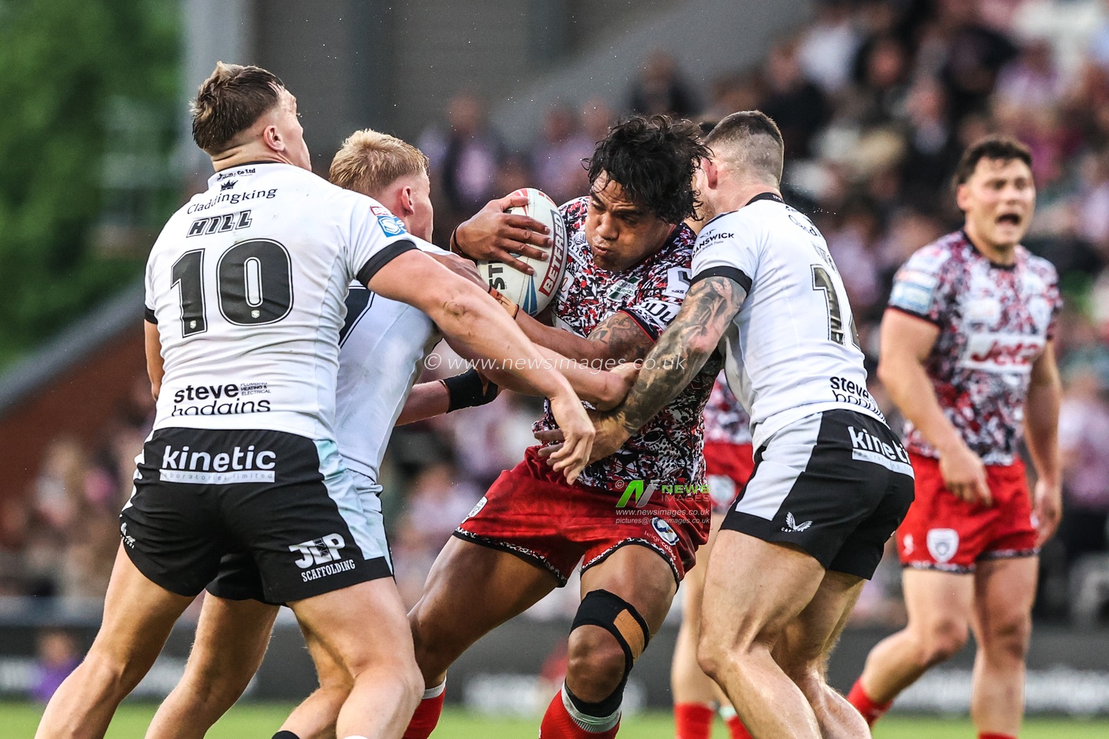 Joe Ofahengaue of Leigh Leopards is tackled by Callum Kemp of Hull FC during the Betfred Super League round 12 match Leigh Leopards vs Hull FC at Leigh Sports Village, Leigh, United Kingdom on 22 May 2026

(Photo by Alfie Cosgrove/News Images)