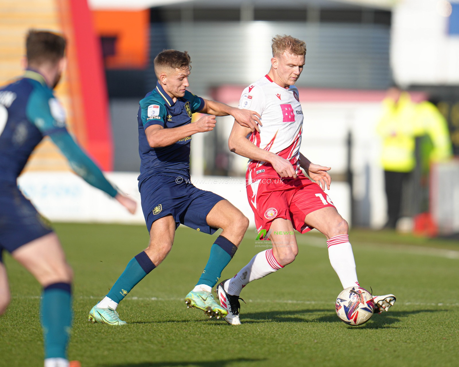 Lewis Freestone of Stevenage platys the ball forward under pressure during the Sky Bet League 1 match Stevenage vs Huddersfield Town at Lamex Stadium, Stevenage, United Kingdom, 1st March 2025

(Photo by Harvey Murphy/News Images)