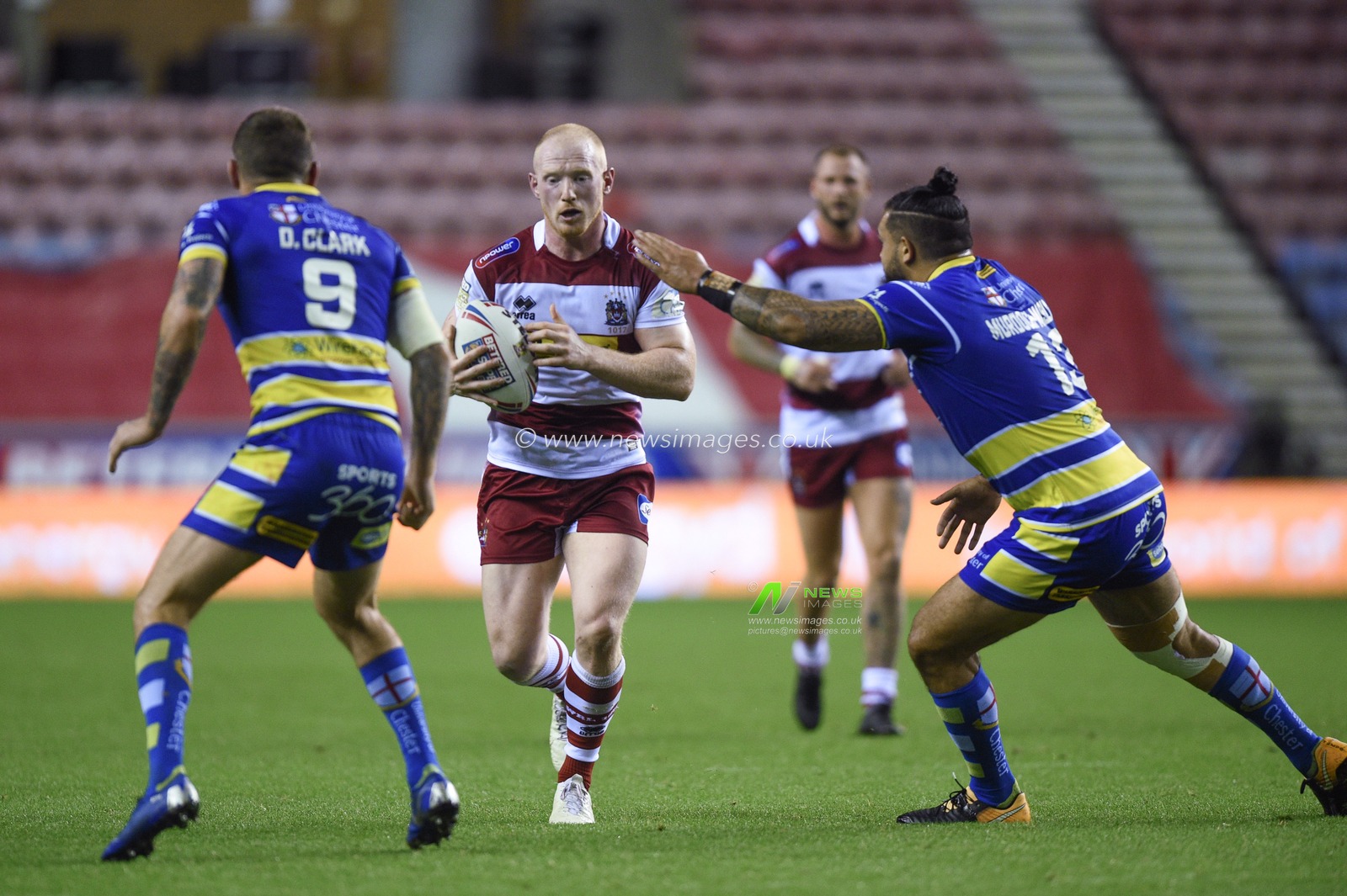 16th August 2019 , DW Stadium, Wigan, England;  Betfred Super League, Round 26, Wigan Warriors vs Warrington Wolves ; Liam Farell of Wigan Warriors is tackled by Ben Murdoch-Masila of Warrington Wolves 

Credit: Richard Long/News Images