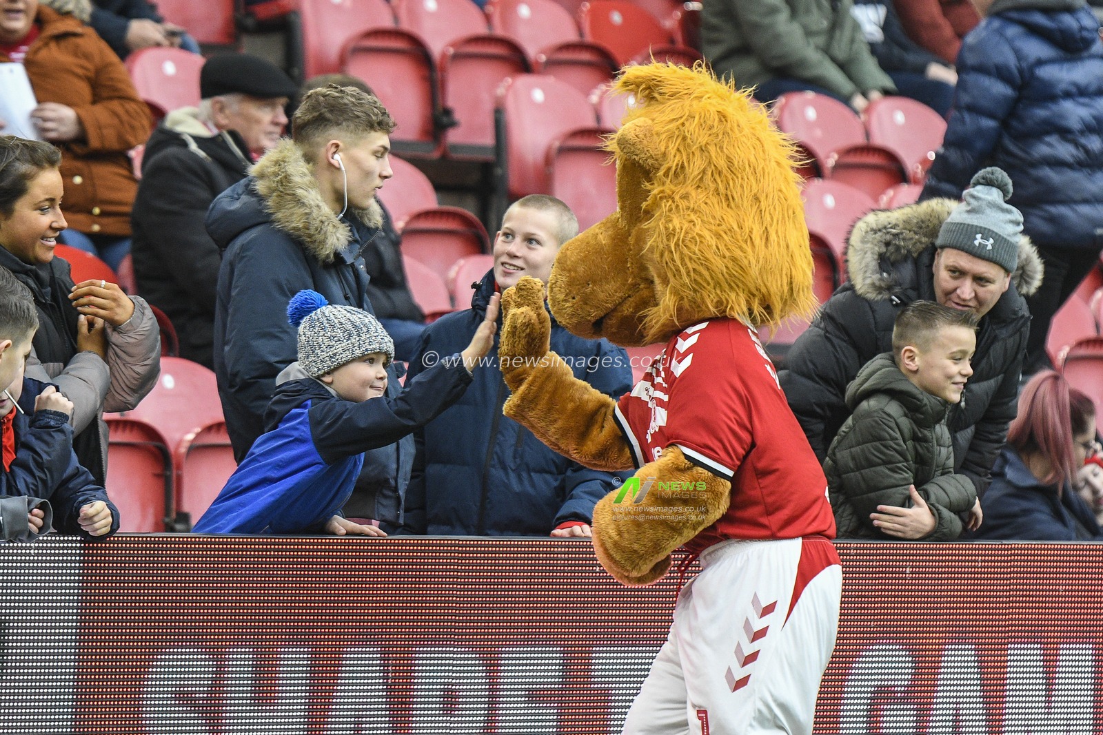 24th November 2019, Riverside Stadium, Middlesbrough, England; Sky Bet Championship, Middlesbrough v Hull City : Roary the Middlesbrough mascot high fives a young fan

Credit: Iam Burn/News Images