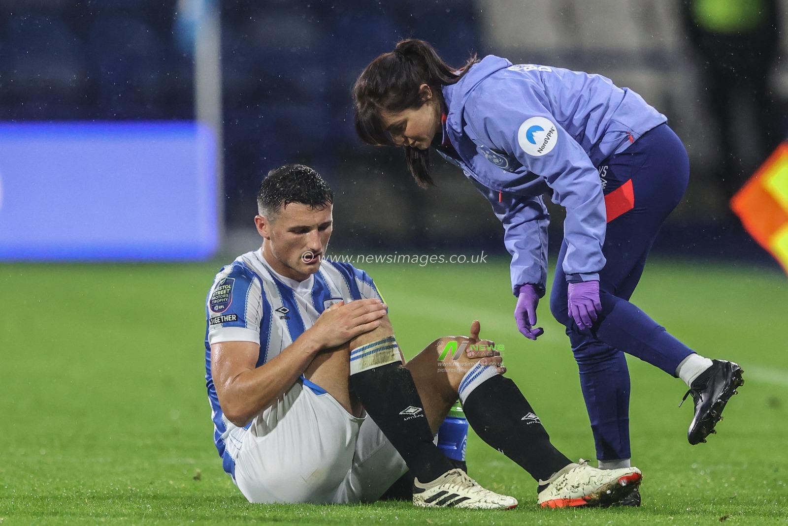 Matty Pearson of Huddersfield Town receives treatment during the Bristol Street Motors Trophy match Huddersfield Town vs Barnsley at John Smith's Stadium, Huddersfield, United Kingdom, 8th October 2024

(Photo by Alfie Cosgrove/News Images)