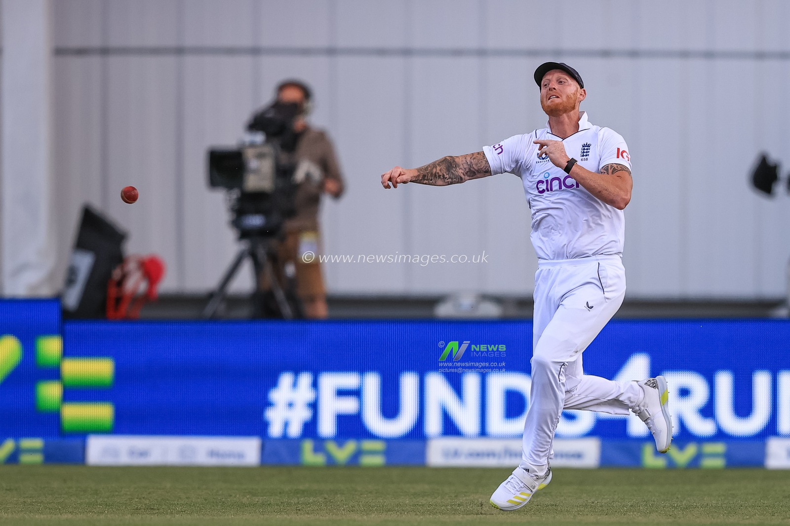 Ben Stokes of England throws the ball back to the wicket