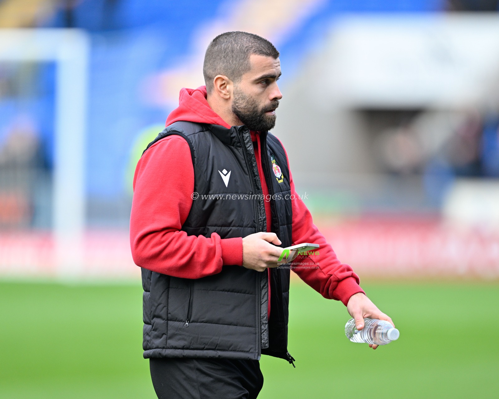 Elliot Lee of Wrexham inspects the pitch ahead of the match, during the Emirates FA Cup Third Round match Shrewsbury Town vs Wrexham at Croud Meadow, Shrewsbury, United Kingdom, 7th January 2024

(Photo by Cody Froggatt/News Images)