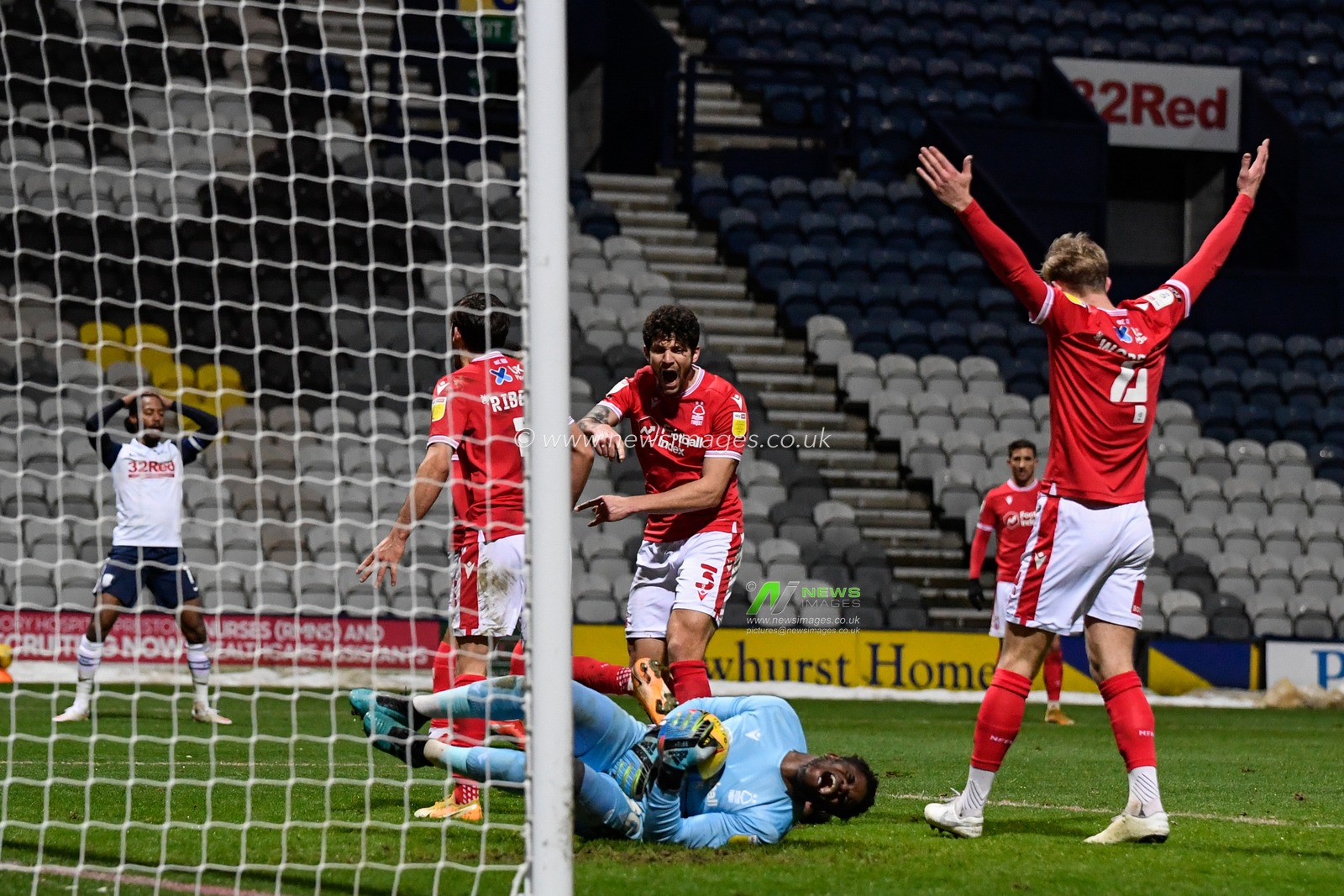 Brice Samba #30 of Nottingham Forest looks in pain after a challenge from Sean Maguire #24 of Preston North End (not pictured)