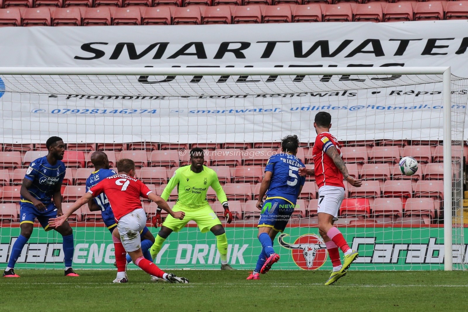 Cauley Woodrow (9) of Barnsley heads the ball wide of the goal