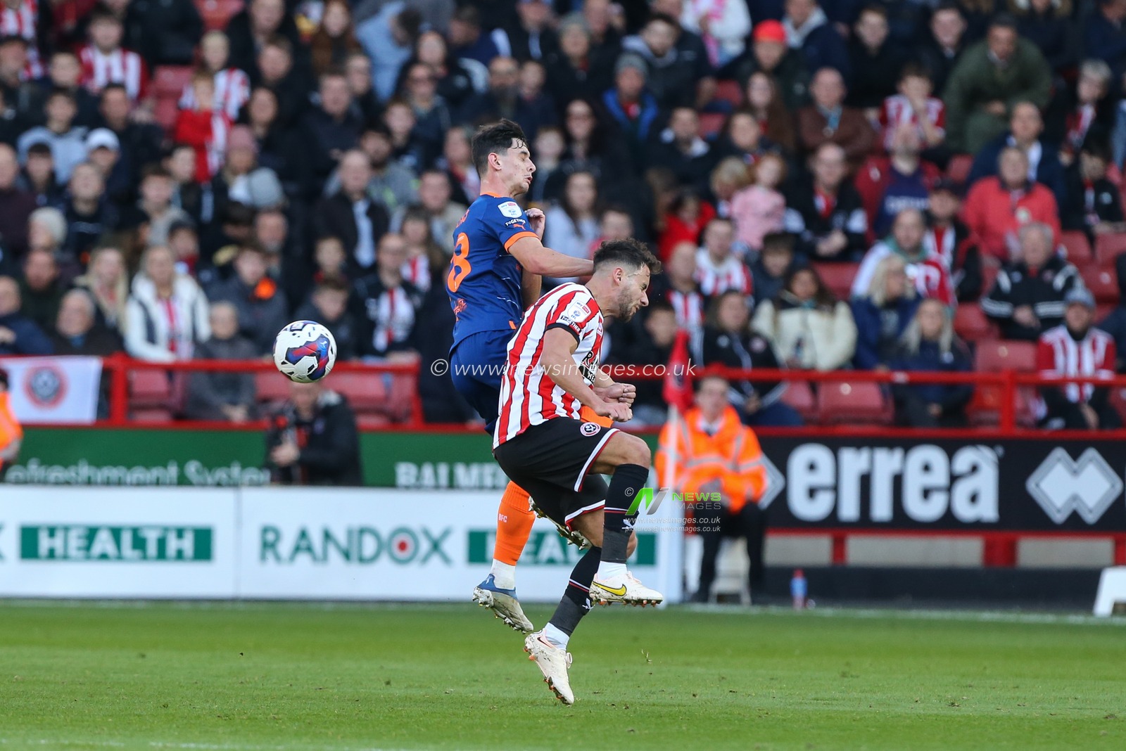 Charlie Patino #28 of Blackpool challenges George Baldock #2 of Sheffield United during the Sky Bet Championship match Sheffield United vs Blackpool at Bramall Lane, Sheffield, United Kingdom, 15th October 2022

(Photo by Arron Gent/News Images)