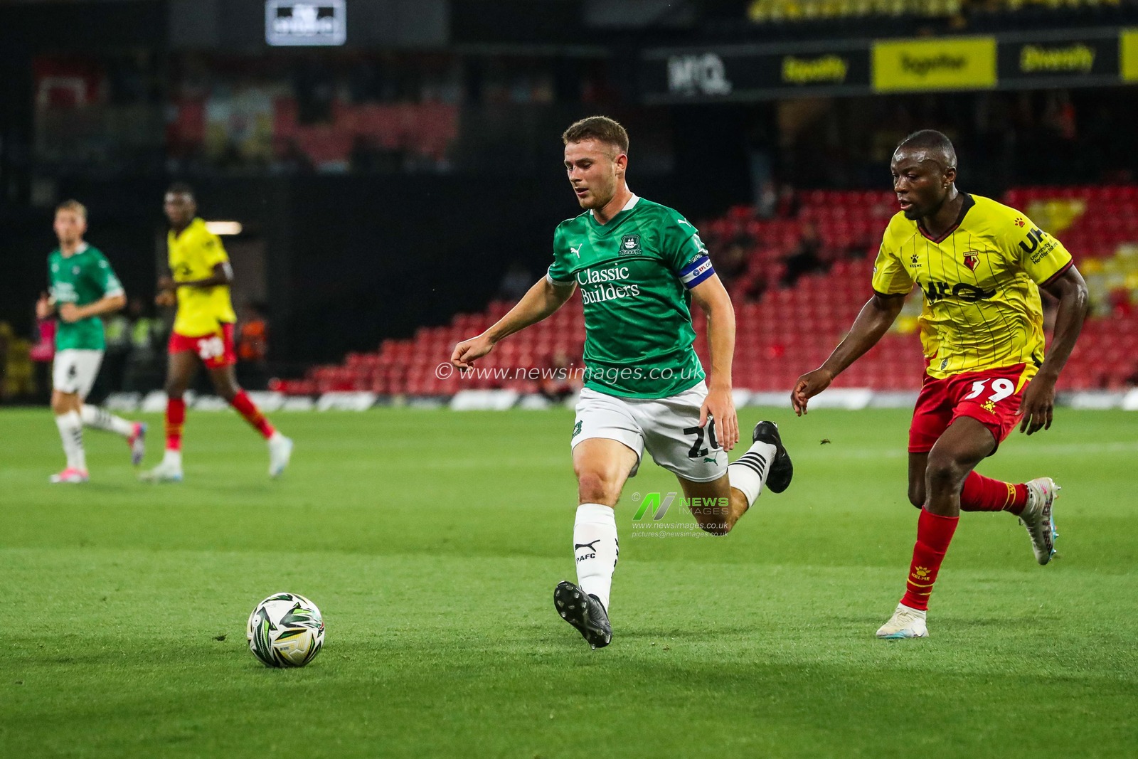 Adam Randell of Plymouth Argyle is put under pressure by Edo Kayembe of Watford during the Carabao Cup match Watford vs Plymouth Argyle at Vicarage Road, Watford, United Kingdom, 27th August 2024

(Photo by Izzy Poles/News Images)