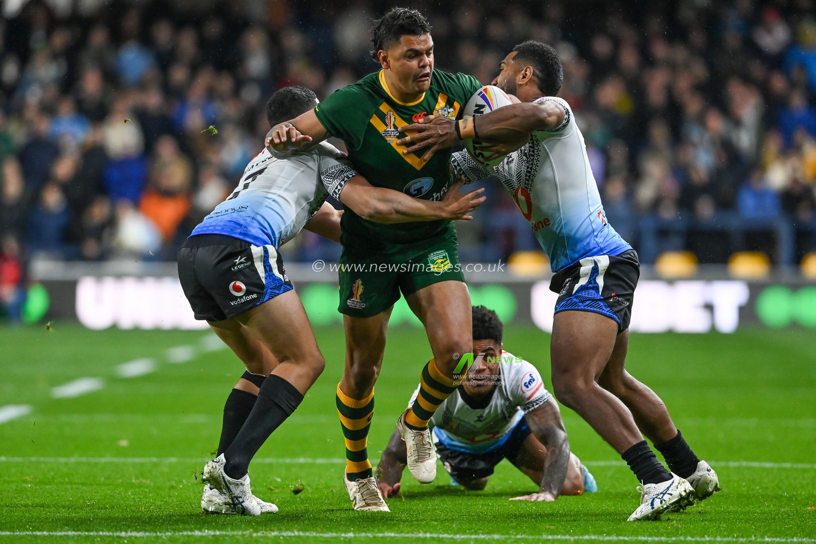Latrell Mitchell of Australia is tackled by Mitieli Vulikijapani and Brandon Wakeham of Fiji during the Rugby League World Cup 2021 match Australia vs Fiji at Headingley Stadium, Leeds, United Kingdom, 15th October 2022

(Photo by Craig Thomas/News Images)