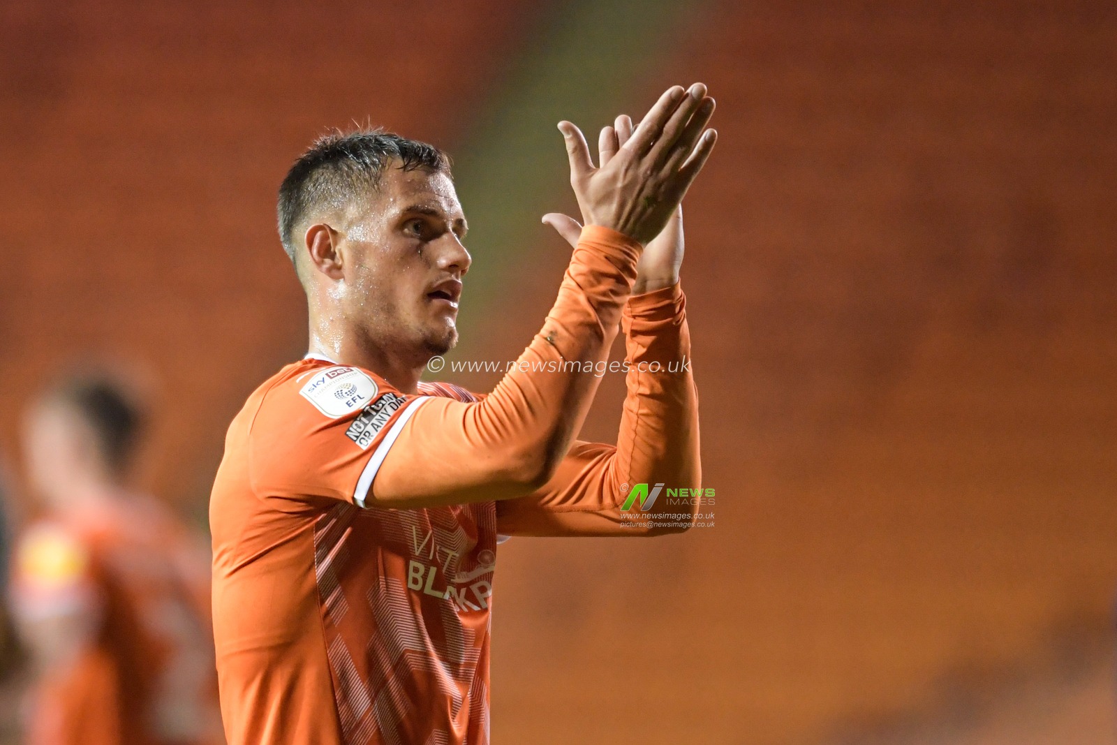 Jerry Yates #9 of Blackpool applauds the home supporters at the end of the game