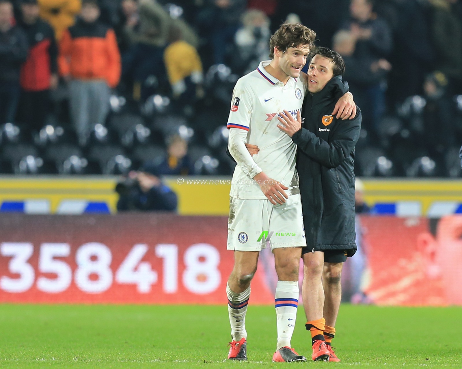 25th January 2020, KC Stadium, Kingston upon Hull, England; Emirates FA Cup, Hull City v Chelsea : Marcos Alonso (3) of Chelsea and George Honeyman  (18) of Hull City after the final whistle