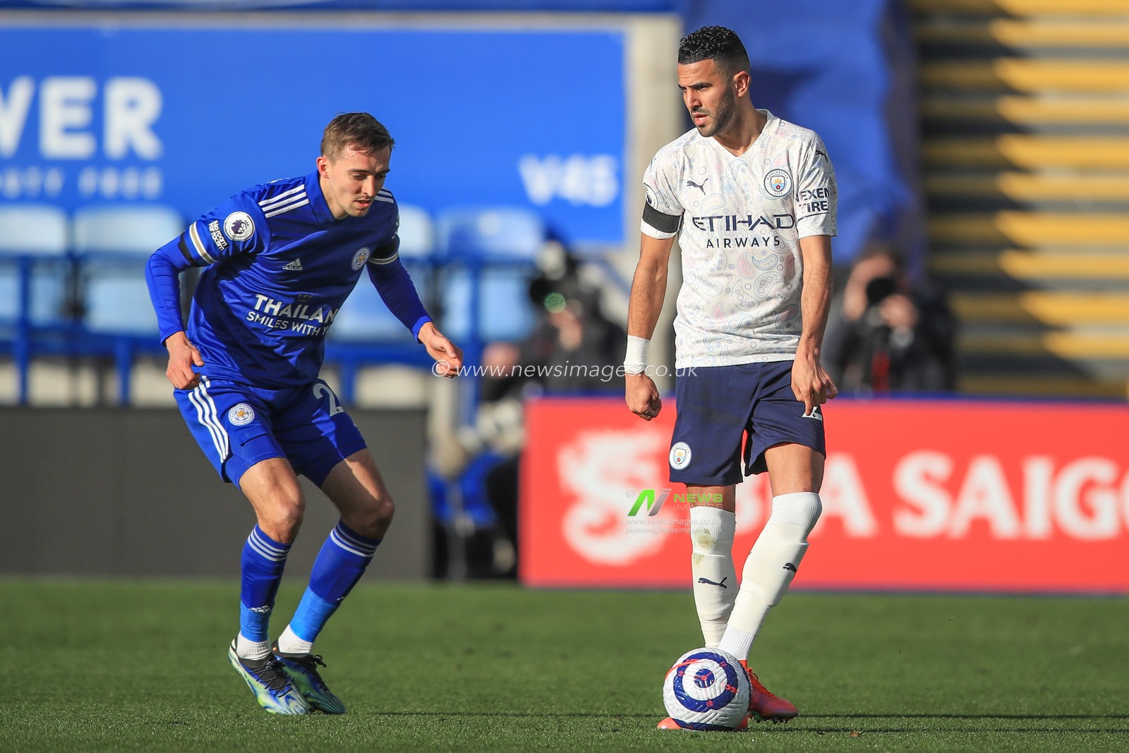 Kyle Walker #2 of Manchester City passes the ball as Timoty Castagne #27 of Leicester City pressures
