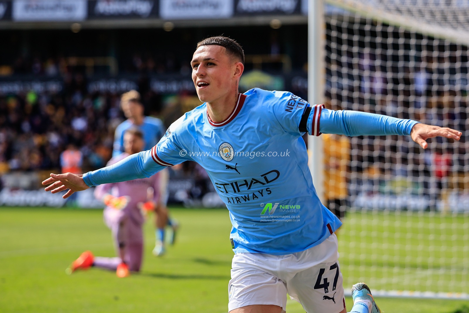 Phil Foden #47 of Manchester City celebrates his goal to make it 0-3 during the Premier League match Wolverhampton Wanderers vs Manchester City at Molineux, Wolverhampton, United Kingdom, 17th September 2022

(Photo by Conor Molloy/News Images)