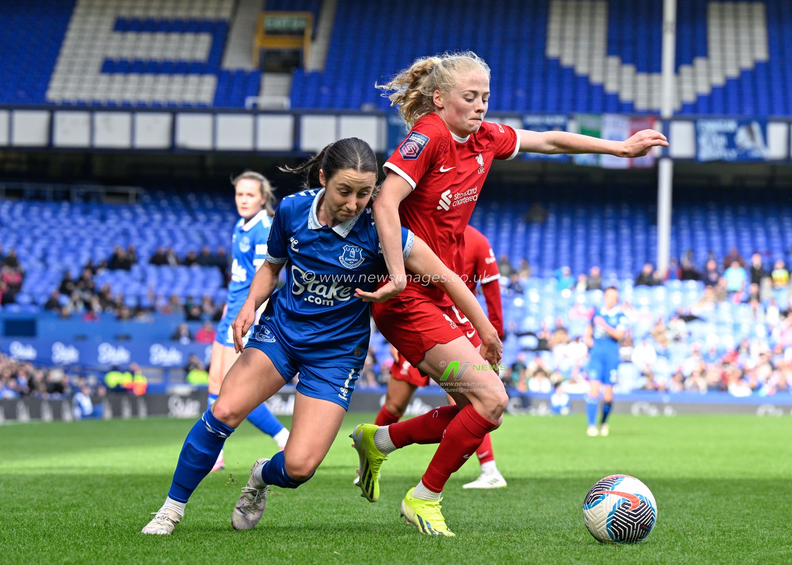 Clare Wheeler of Everton Women and Grace Fisk of Liverpool Women battle for the ball, during The FA Women's Super League match Everton Women vs Liverpool Women at Goodison Park, Liverpool, United Kingdom, 24th March 2024

(Photo by Cody Froggatt/News Images)
