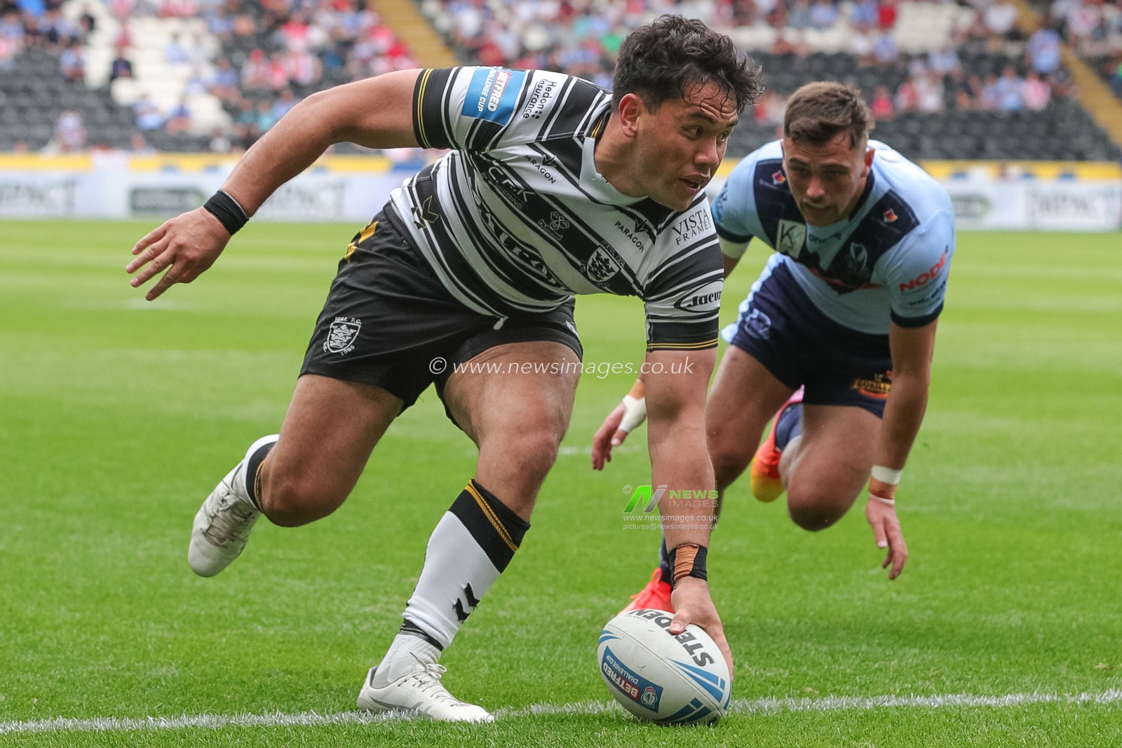 Andre Savelio #11 of Hull FC goes over for a try and makes the score 10-8 in the first half of the Betfred Challenge Cup match Hull FC vs St Helens at MKM Stadium, Hull, United Kingdom, 17th June 2023

(Photo by James Heaton/News Images)