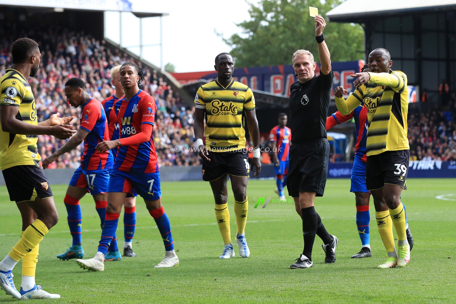 RED CARD: Hassane Kamara #14 of Watford receives a second yellow card from referee, Graham Scott