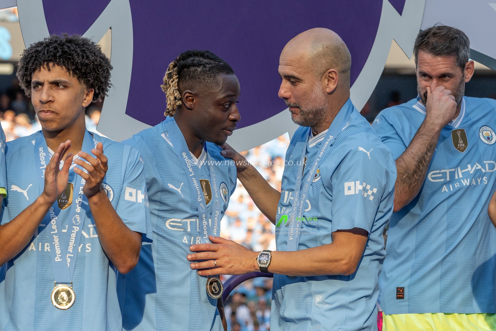 Pep Guardiola manager of Manchester City and JÃ©rÃ©my Doku of Manchester City during the Premier League match Manchester City vs West Ham United at Etihad Stadium, Manchester, United Kingdom, 19th May 2024

(Photo by Mark Cosgrove/News Images)