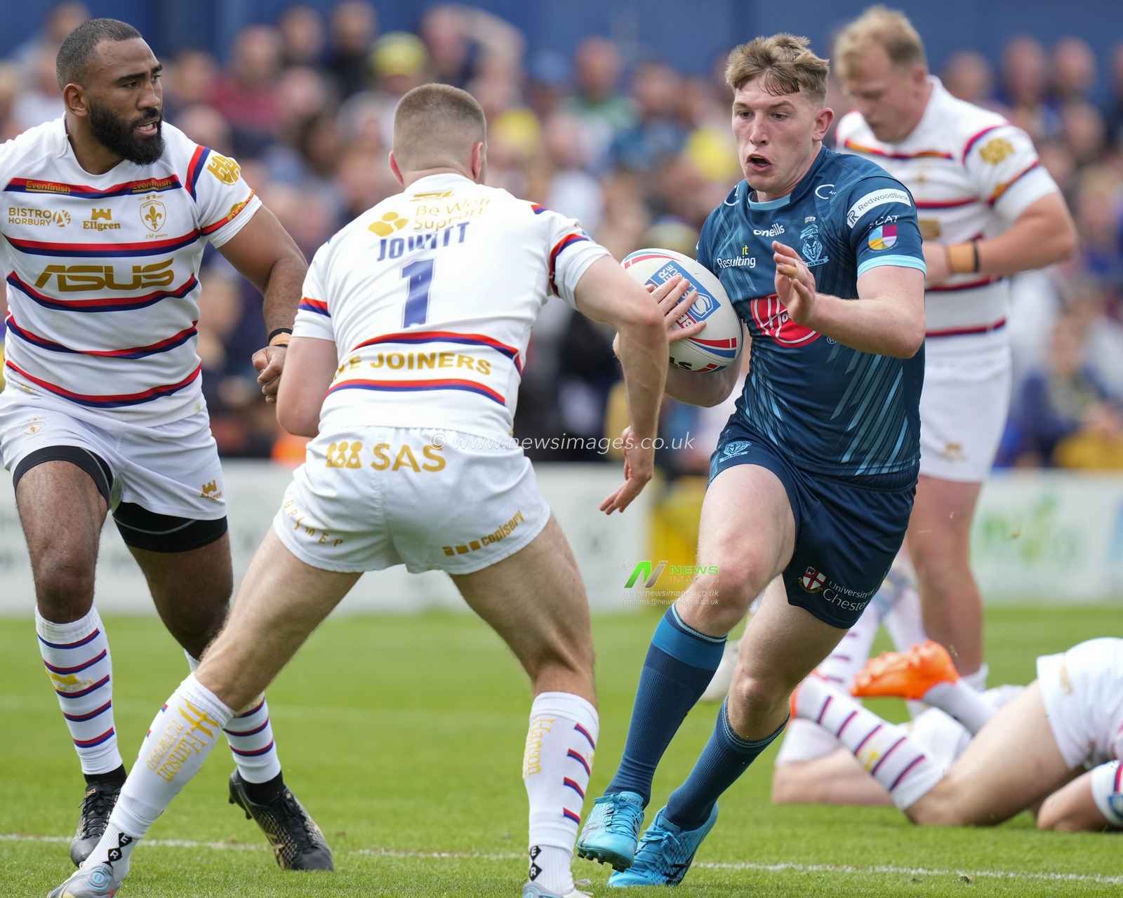 Matty Nicholson #12 of Warrington Wolves runs at Max Jowitt #1 of Wakefield Trinity during the Betfred Super League Round 20 match Wakefield Trinity vs Warrington Wolves at The Be Well Support Stadium, Wakefield, United Kingdom, 30th July 2023

(Photo by Steve Flynn/News Images)
