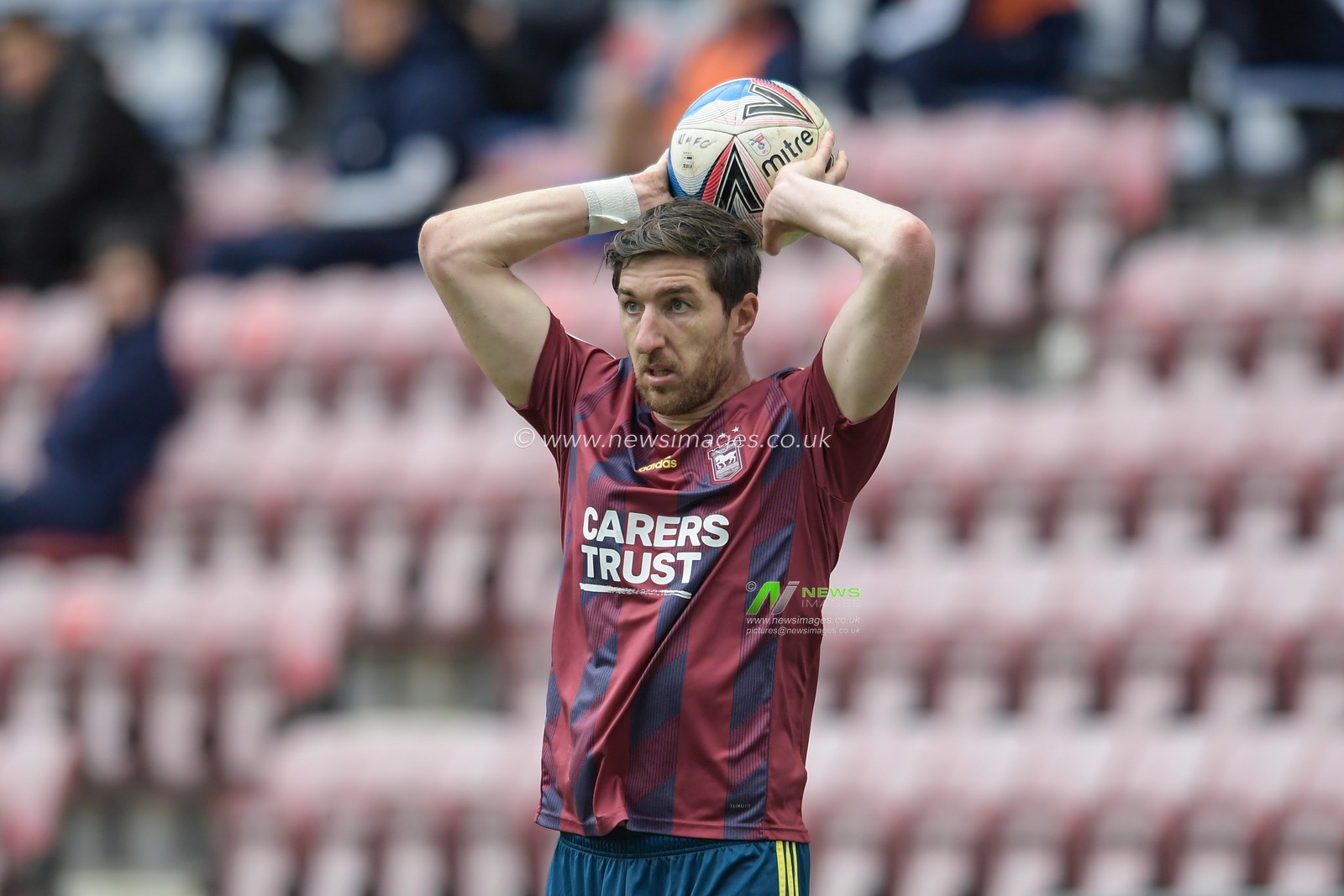 Stephen Ward #3 of Ipswich Town takes a throw in