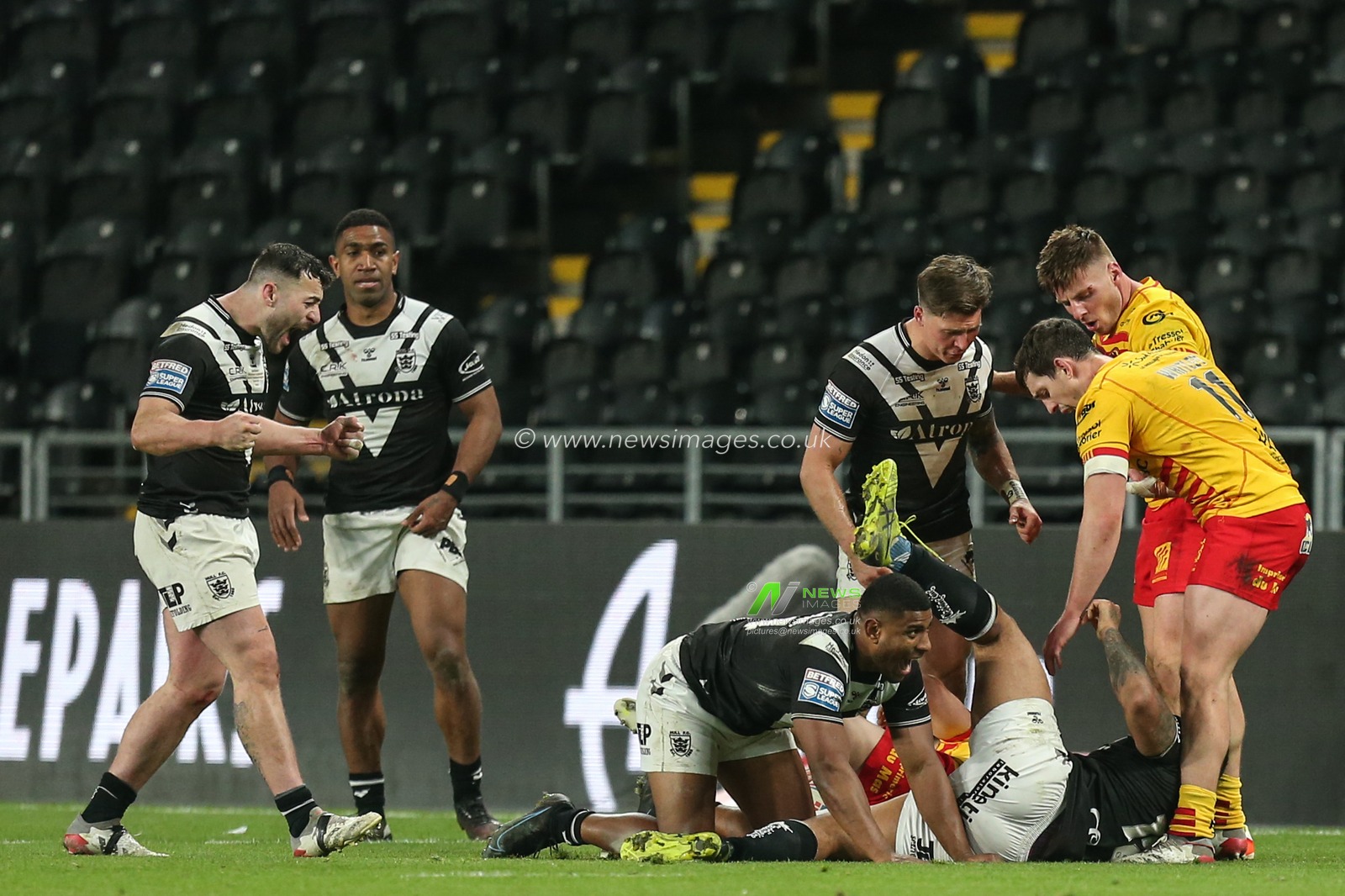 Jake Connor #1 and Joe Lovodua #14 of Hull FC all smiles after making a tackle which secures the victory for Hull FC