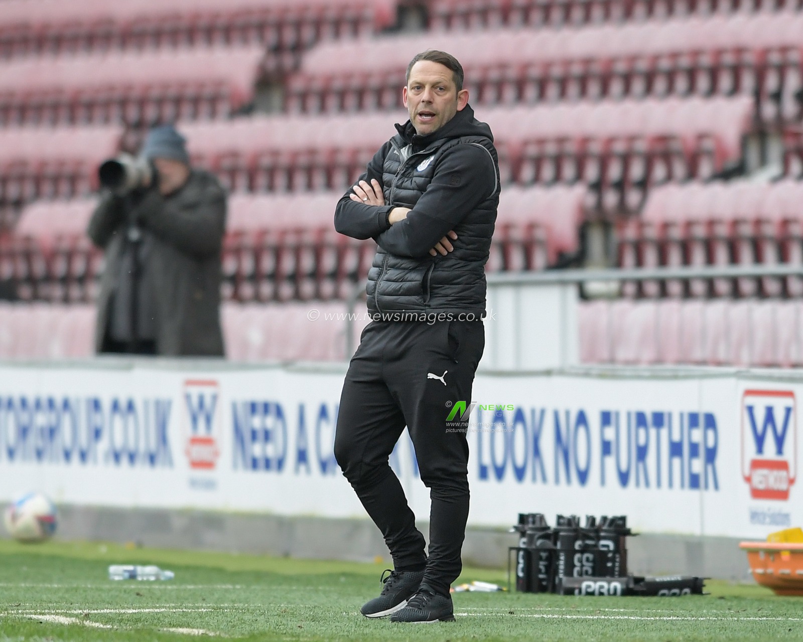 Leam Richardson manager of Wigan Athletic watches the game from the technical area