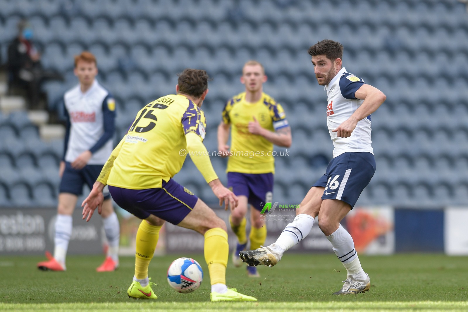 Ched Evans #26 of Preston North End passes the ball under pressure