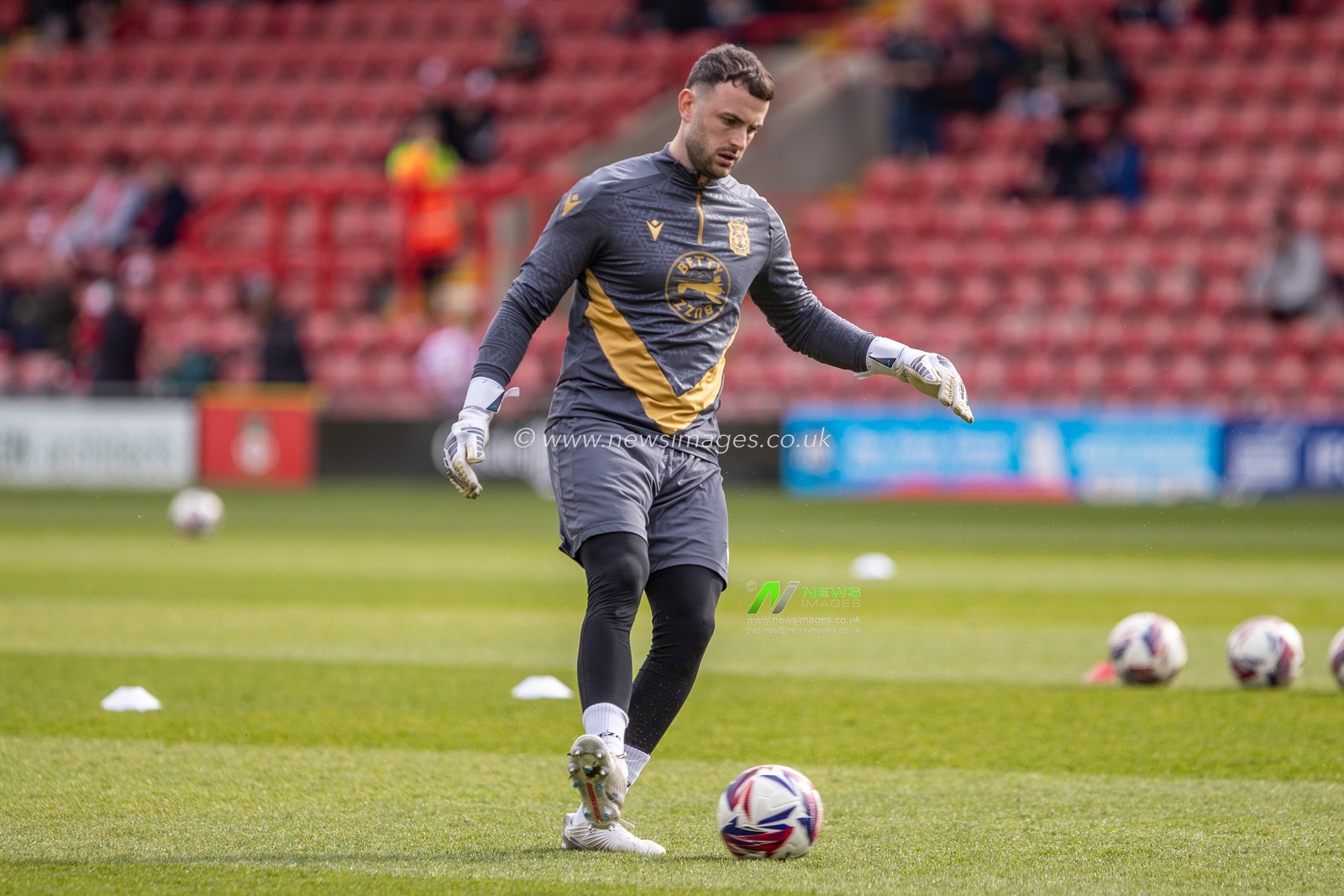Wrexham's Callum Burton warms up during the Sky Bet League 1 match Wrexham vs Stockport County at SToK Cae Ras, Wrexham, United Kingdom, 22nd March 2025

(Photo by Nik Mesney/News Images)