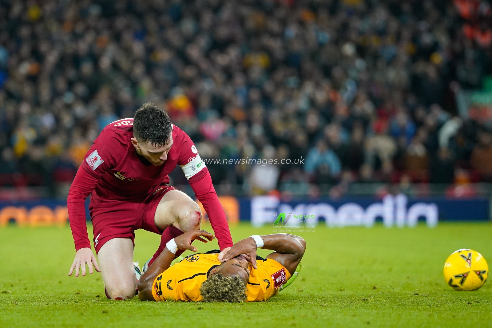 Andrew Robertson #26 of Liverpool checks on Adama TraorÃ© #37 of Wolverhampton Wanderers after a tackle during the Emirates FA Cup Third Round match Liverpool vs Wolverhampton Wanderers at Anfield, Liverpool, United Kingdom, 7th January 2023

(Photo by Steve Flynn/News Images)