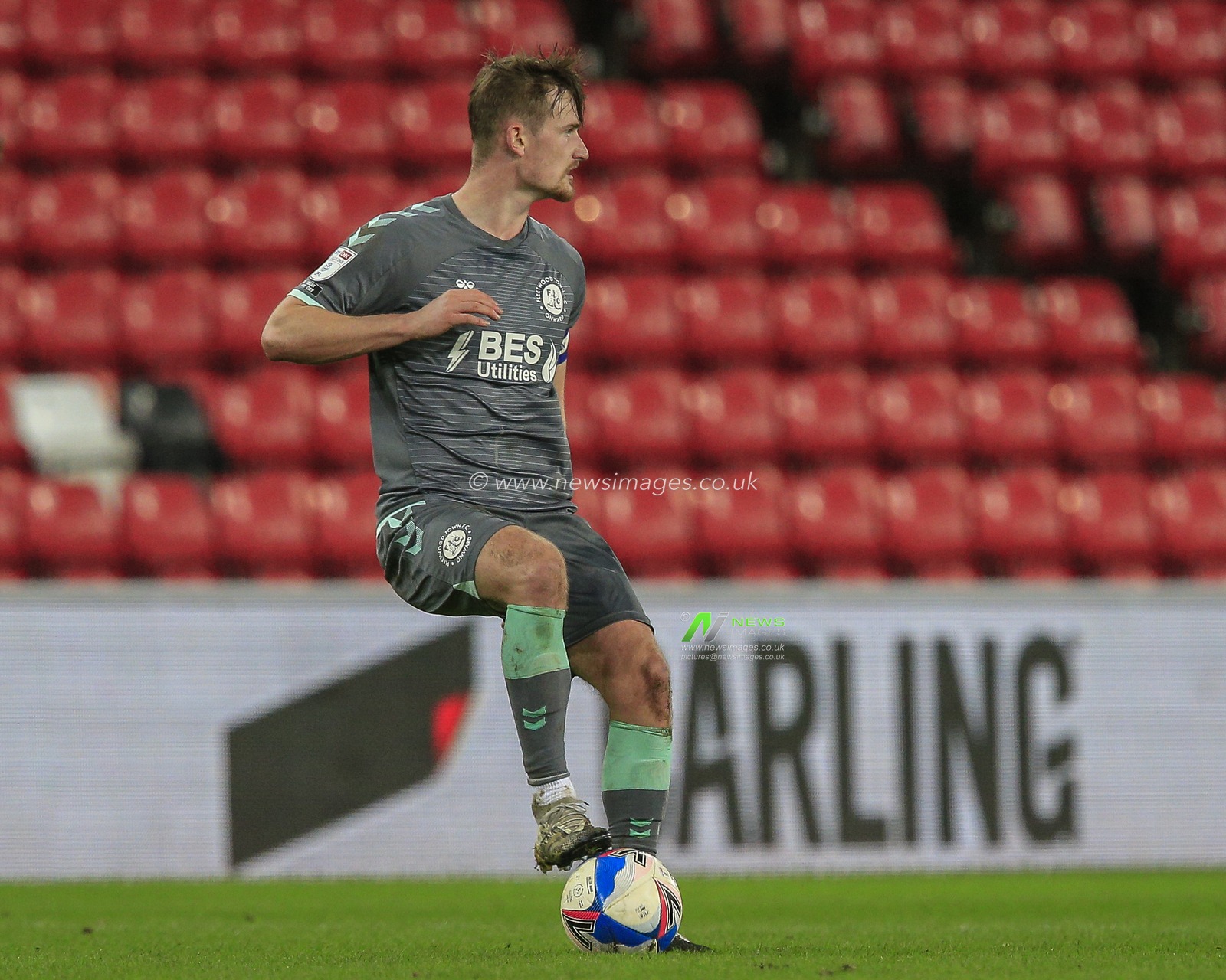 Callum Connolly #4 of Fleetwood Town with the ball