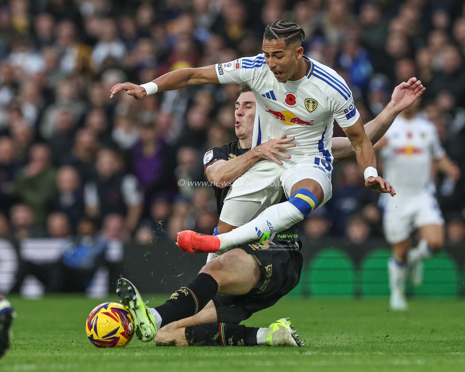Jimmy Dunne of Queens Park Rangers slide tackles Mateo Joseph of Leeds United, no foul during the Sky Bet Championship match Leeds United vs Queens Park Rangers at Elland Road, Leeds, United Kingdom, 9th November 2024

(Photo by Mark Cosgrove/News Images)
