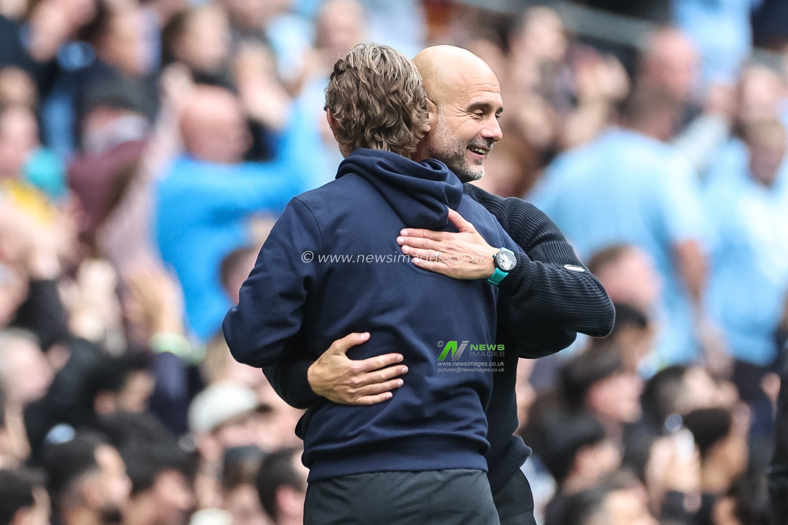 Pep Guardiola manager of Manchester City embraces Thomas Frank manager of Brentford after City win 2-1 during the Premier League match Manchester City vs Brentford at Etihad Stadium, Manchester, United Kingdom, 14th September 2024

(Photo by Mark Cosgrove/News Images)
