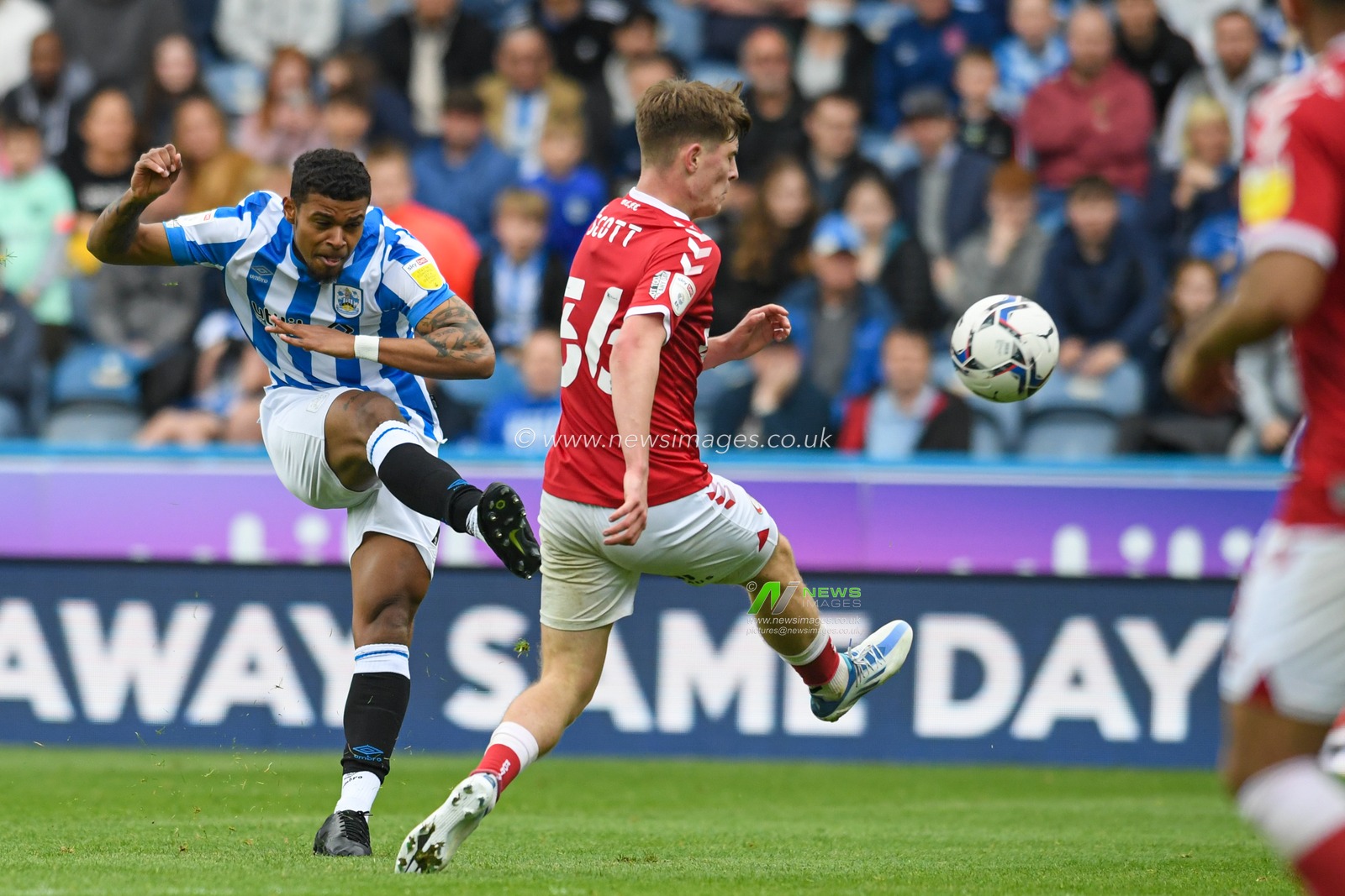 Tino Anjorin #7 of Huddersfield Town has a shot at goal