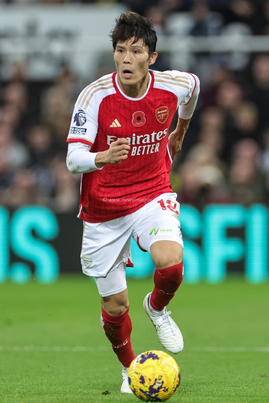 Takehiro Tomiyasu #18 of Arsenal with the ball during the Premier League match Newcastle United vs Arsenal at St. James's Park, Newcastle, United Kingdom, 4th November 2023

(Photo by Mark Cosgrove/News Images)