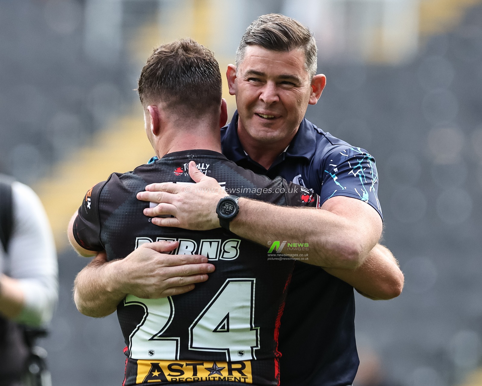 Paul Wellens Head Coach of St. Helens celebrates the win with try hero Jake Burns during the Betfred Super League Round 20 match Hull FC vs St Helens at MKM Stadium, Hull, United Kingdom, 3rd August 2024

(Photo by Mark Cosgrove/News Images)
