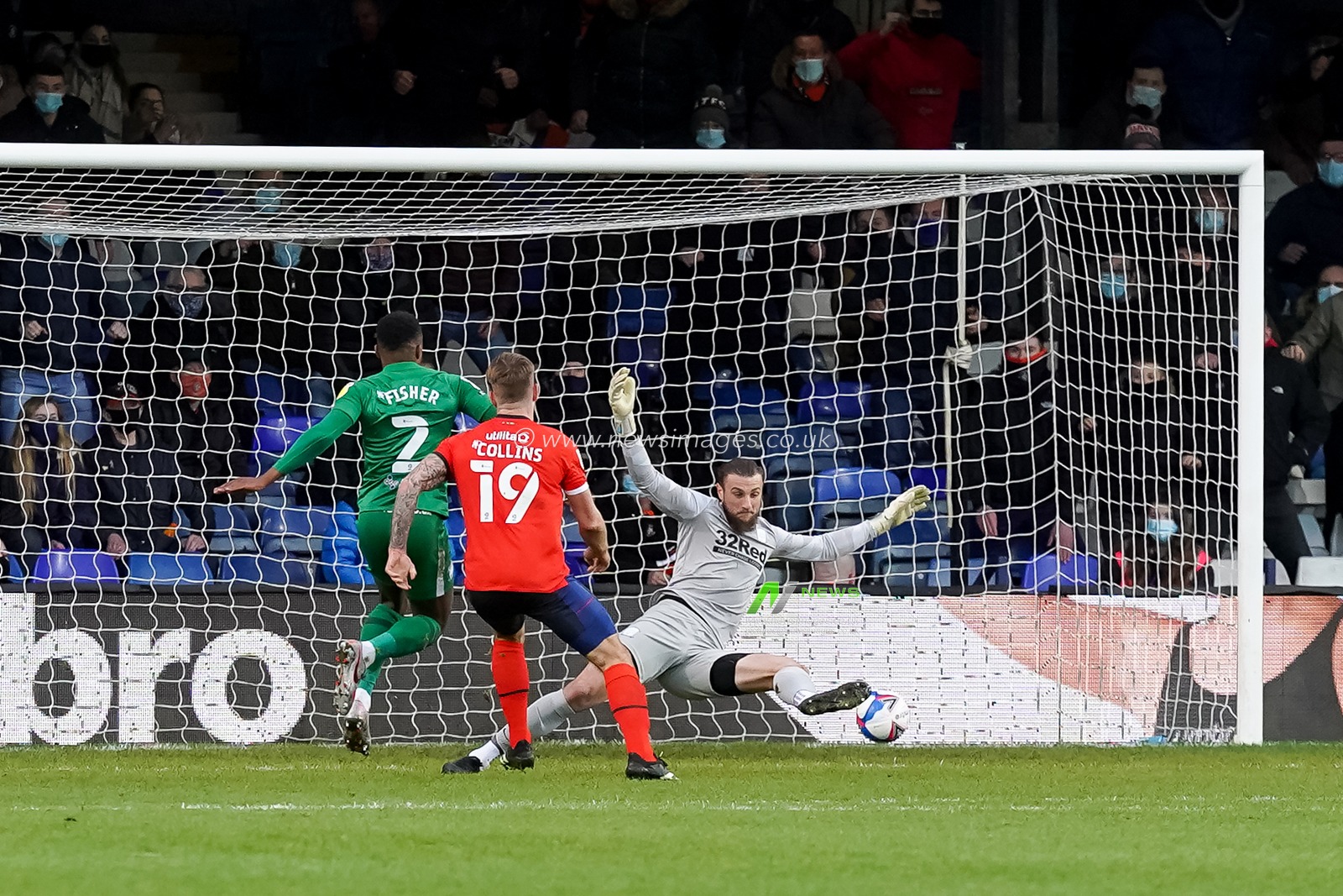 James Collins #19 of Luton Town scores the opening goal of the game to make it  1:0