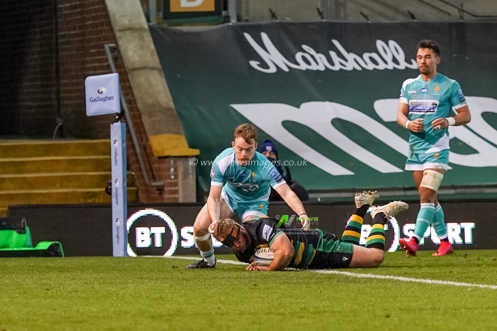 Mikey Haywood #16 of Northampton Saints scores a try