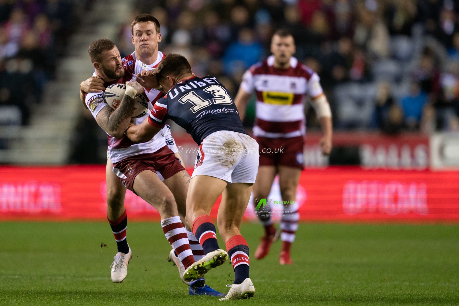 Wigan Warriors's Zak Hardaker Sydney Roosters Victor Radley


17th February  2019 , DW Stadium, Wigan, England;  Betfred World Club Challenge, Wigan Warriors vs Sydney Roosters ; 

Credit: Terry Donnelly/News Images