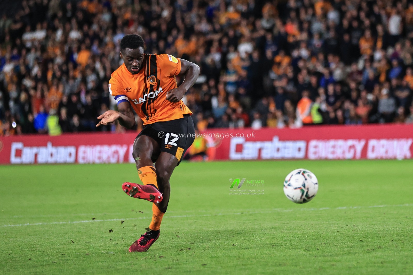 Josh Emmanuel #12 of Hull City scores his penalty